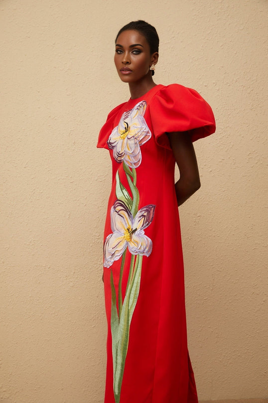 Camryn Red Sequined Floral Embroidered Midi Dress in stunning red and multicolor hues, featuring floral embroidery, sequin embellishments, round neck, short puff sleeves, cinched waist, rear slit, and rear zip fastening