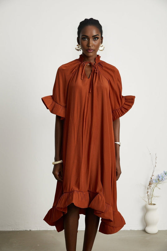 Carmelina Brown Midi Dress in Luxurious Terylene with Frilled Self-Tie Neck and Asymmetric Hem