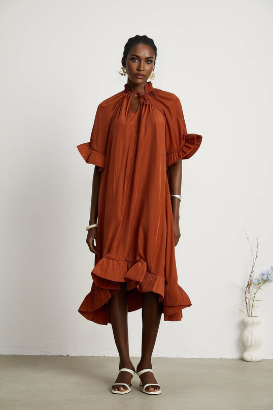 Carmelina Brown Midi Dress in Luxurious Terylene with Frilled Self-Tie Neck and Asymmetric Hem