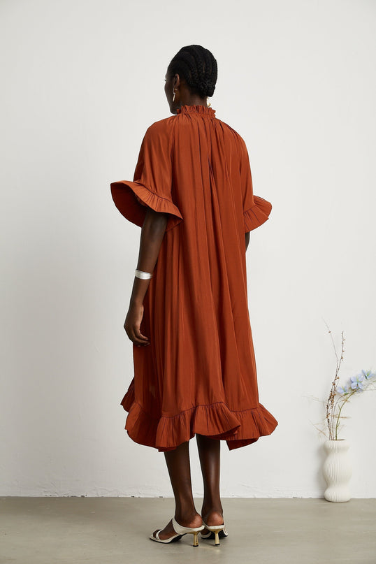 Carmelina Brown Midi Dress in Luxurious Terylene with Frilled Self-Tie Neck and Asymmetric Hem