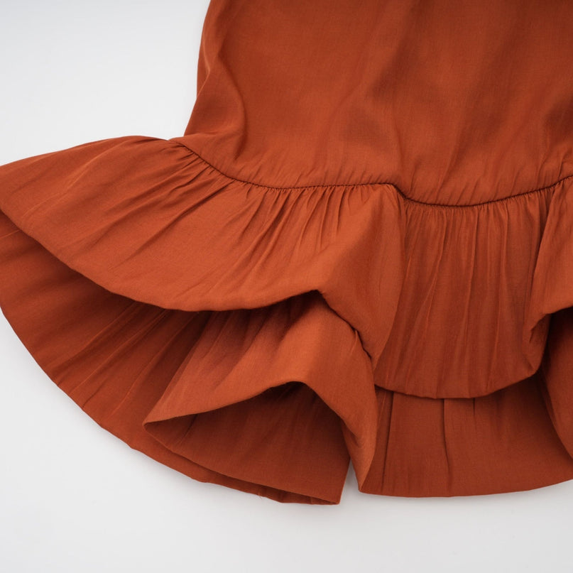 Carmelina Brown Midi Dress in Luxurious Terylene with Frilled Self-Tie Neck and Asymmetric Hem