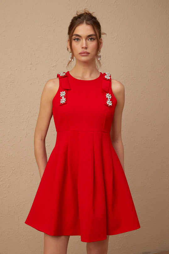 Caroline Red Textured Mini Dress Crystal Embellishment Bow Detailing Pleated Skirt Sleeveless Round Neck Thigh Length Rear Zip Fastening
