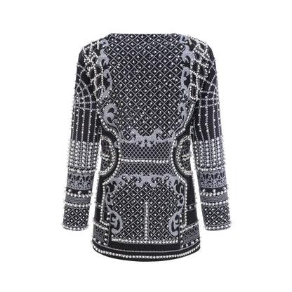 Catherine pattern print V neck blazer dress worn by model standing against plain background