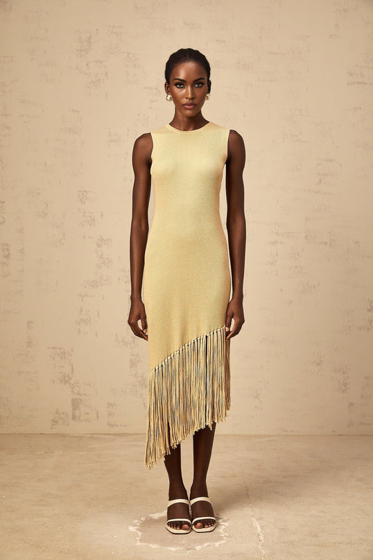 Celeste Midi Dress in Neutrals ribbed knit fringed edge macramé metallic threading asymmetrical hem slip-on style timeless silhouette understated chic palette luxury midi-length marvel statement piece 100% Terylene fiber sartorial masterpiece