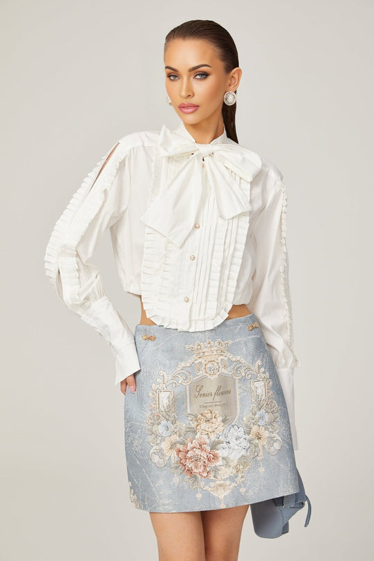 Céleste white pleated scarfcollar shirt