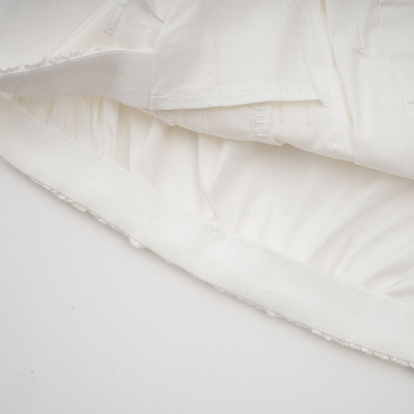 Céleste white pleated scarfcollar shirt