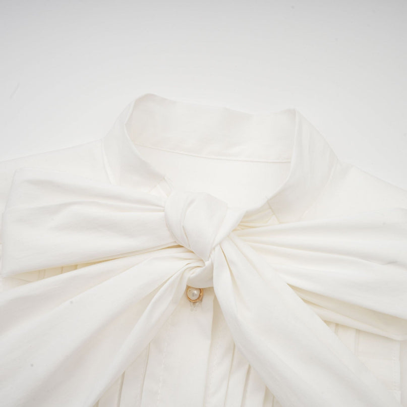 Céleste white pleated scarfcollar shirt