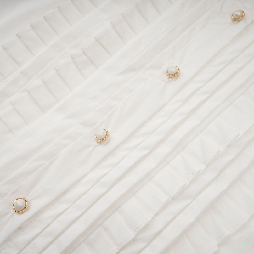 Céleste white pleated scarfcollar shirt