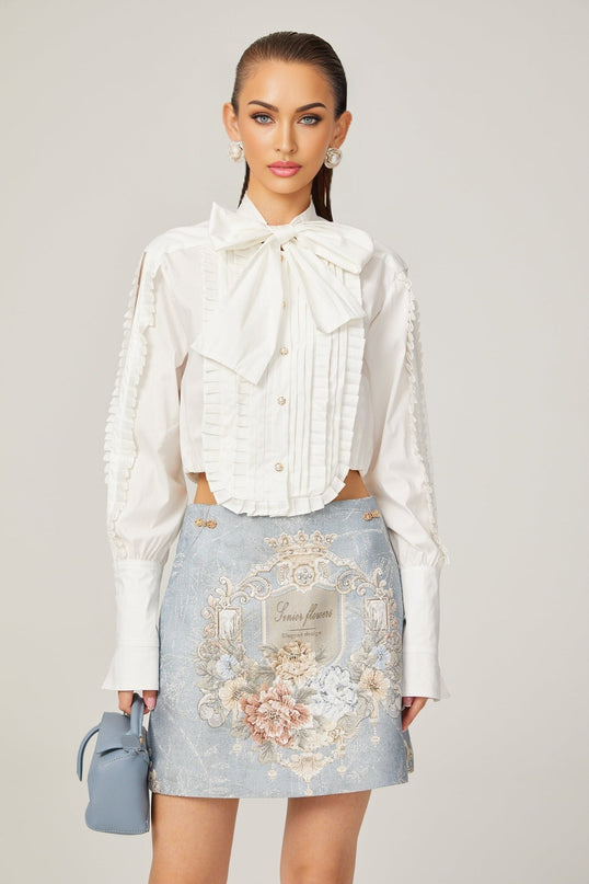 Céleste white pleated scarfcollar shirt