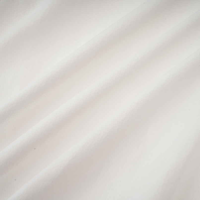 Céleste white pleated scarfcollar shirt