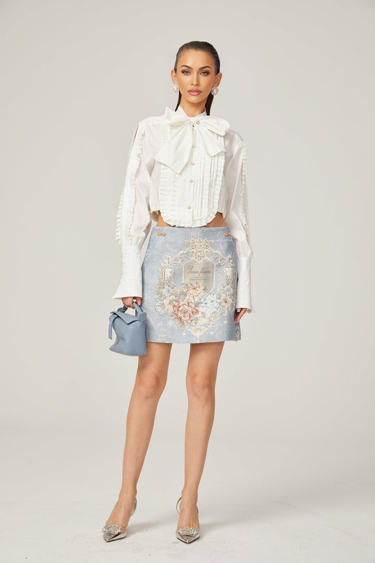 Céleste white pleated scarfcollar shirt