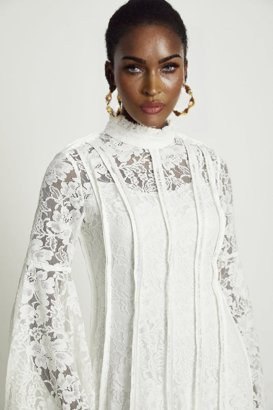 Céline White Lace A-Line Midi Dress with Flared Sleeves and Ruffled Hemline