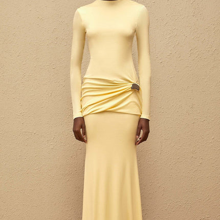 Charlotte Maxi Dress in Yellow with crew neck, long sleeves, fitted waistline, flared hem, gathered detailing, shirred panel, embossed silver-tone hardware, rear slit, and zip fastening