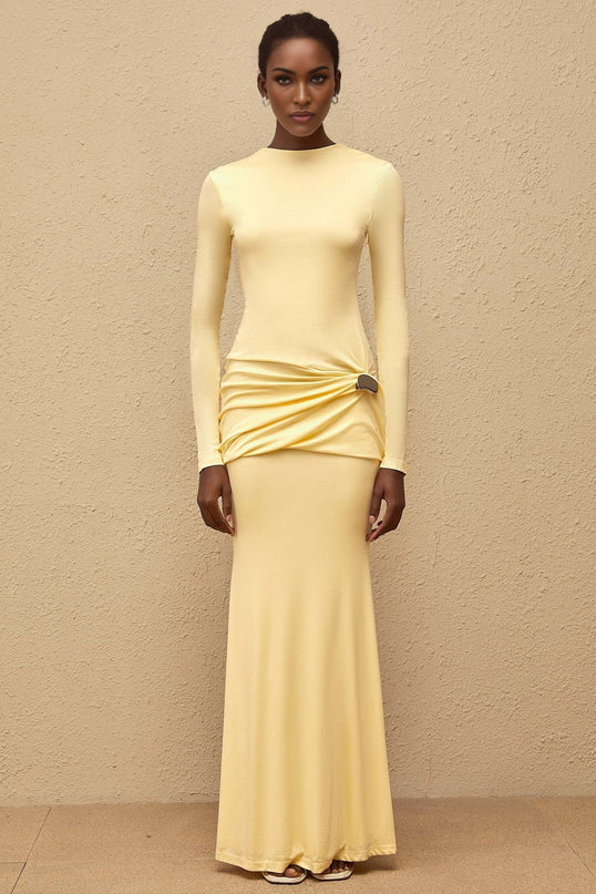 Charlotte Maxi Dress in Yellow with crew neck, long sleeves, fitted waistline, flared hem, gathered detailing, shirred panel, embossed silver-tone hardware, rear slit, and zip fastening