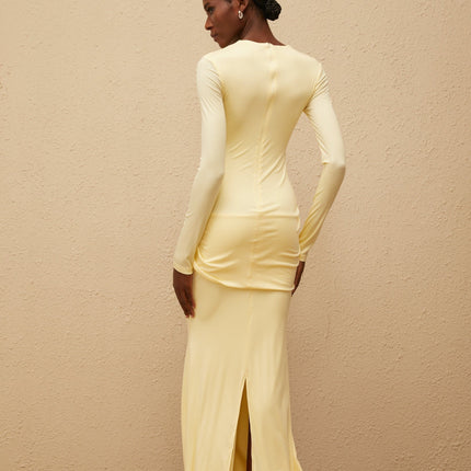 Charlotte Maxi Dress in Yellow with crew neck, long sleeves, fitted waistline, and flared hem