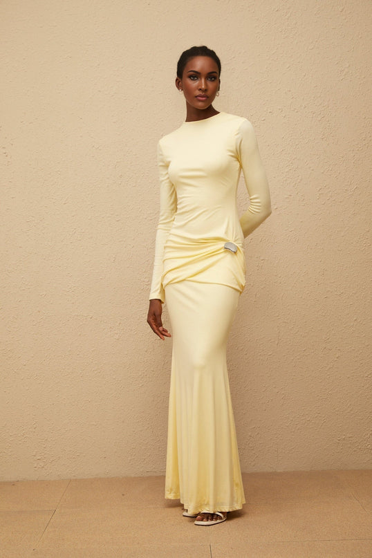 Charlotte Maxi Dress in Yellow crew neck long sleeves fitted waistline flared hem gathered detailing shirred panel embossed silver-tone hardware rear slit zip fastening 95% Lyocell 5% Spandex refined style impeccable craftsmanship