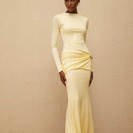 Charlotte Maxi Dress in Yellow with crew neck, long sleeves, fitted waistline, flared hem, gathered detailing, shirred panel, embossed silver-tone hardware, rear slit, and zip fastening