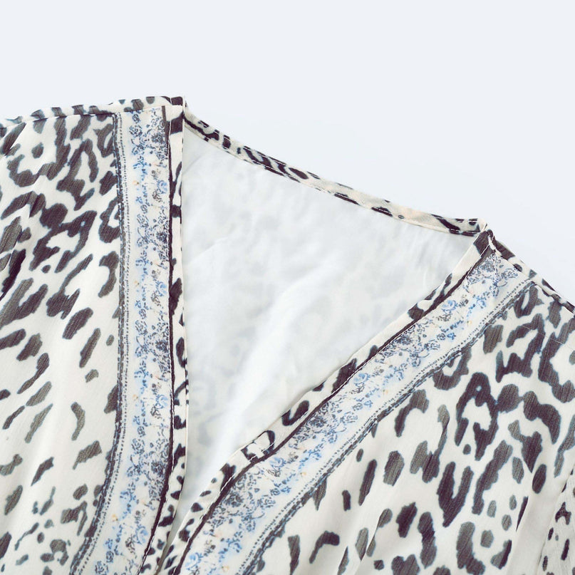 Chloe White Floral Maxi Dress with V-neck and ruffled hem in Terylene and Rayon blend