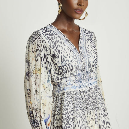 Chloe White Floral Maxi Dress with V-neck and ruffled hem in 65% Terylene and 35% Rayon
