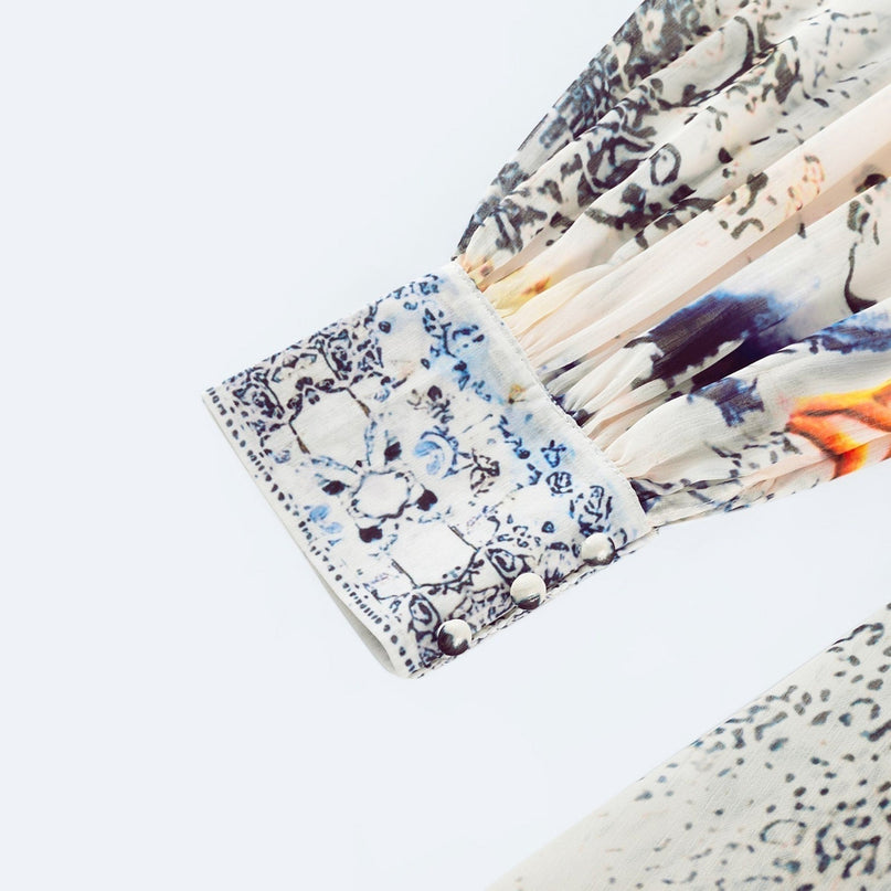 Chloe White Floral Maxi Dress with V-neck and ruffled hem in Terylene and Rayon blend