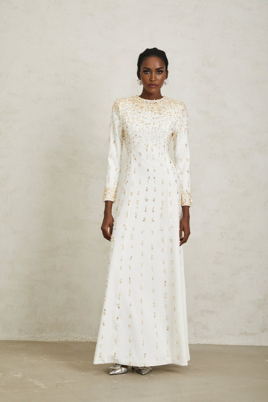 Clara Maxi Dress in White with sequin, faux-pearl, and crystal embellishments, rear zip fastening, and voluminous skirt