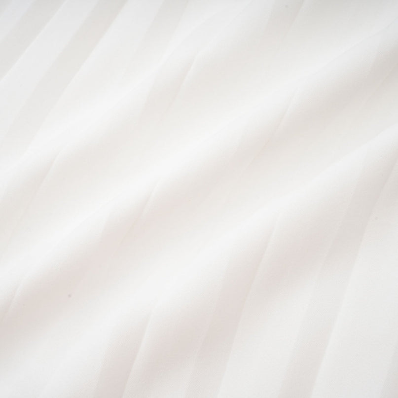 Claudette White Pleated Mini Dress V-neckline Flared Pleated Cuffs Long Sleeves Textured Finish Lacing Detail Cinches Waist Polyester Cotton Blend Elegant Daywear Summer Occasions Chic Gatherings Flowy Mini Length Timeless Piece