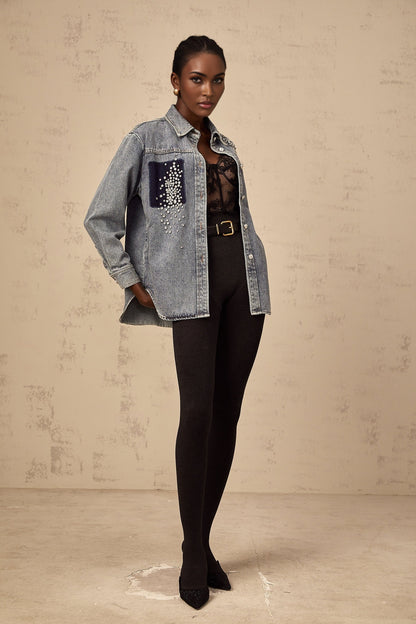 Closeup of light blue denim shirt with small rhinestone embellishments scattered across the fabric Ségolène brand visible on collar