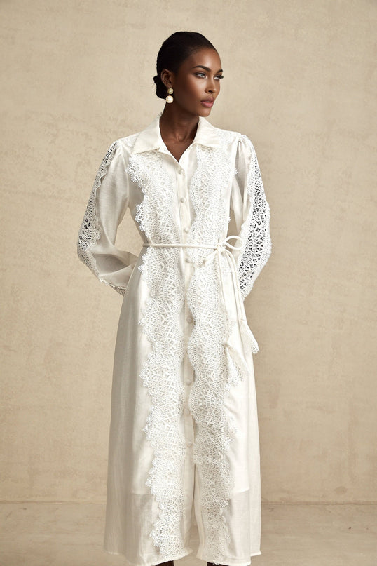 Colette white midi dress with lace details and tied waist on model