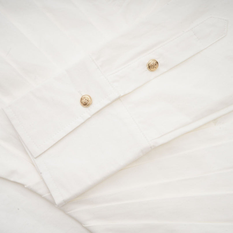 Coraline White Mini Dress with Embossed Gold Buttons and Pleated Detailing