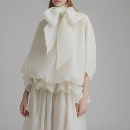 Dakota Cream White Maxi Dress Tied Neck Batwing Sleeves Ruffled Pleat Design Partial Lining Pleated Detailing 100% Terylene Fiber Semi-Sheer Maxi Length Sophisticated Elegant Versatile Whimsical Charm Garden Party Soirée