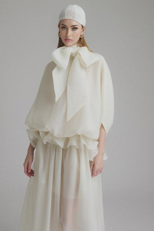 Dakota Cream White Maxi Dress Tied Neck Batwing Sleeves Ruffled Pleat Design Partial Lining Pleated Detailing 100% Terylene Fiber Semi-Sheer Maxi Length Sophisticated Elegant Versatile Whimsical Charm Garden Party Soirée