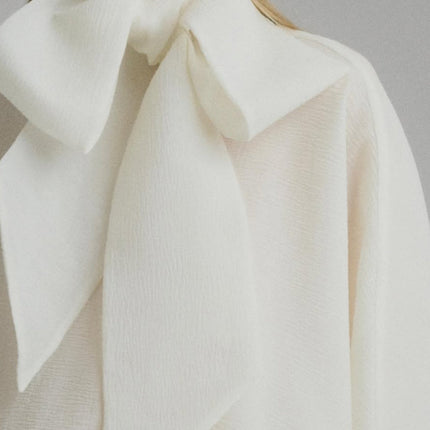 Dakota Cream White Maxi Dress Tied Neck Batwing Sleeves Ruffled Pleat Design Partial Lining Pleated Detailing Luxurious Terylene Fiber Semi-Sheer Construction Maxi Length Elegant Sophisticated Whimsical Charm Versatile Feminine Grace Soiree Garden Party Timeless Style Modern Elegance
