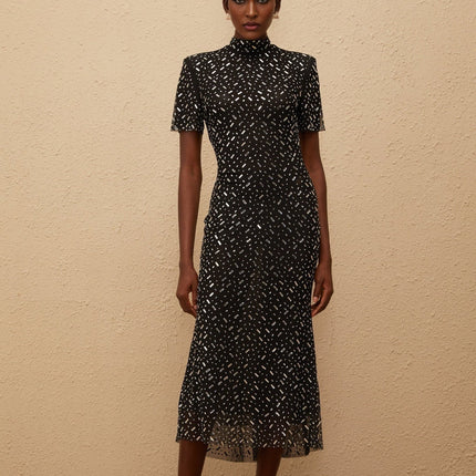 Danielle Mesh Embellished Black Midi Dress with crystal and rhinestone embellishment mock neck short sleeves fitted waistline flared hem calf-length modern glamour luxurious blend of 95% Terylene fiber and 5% Spandex