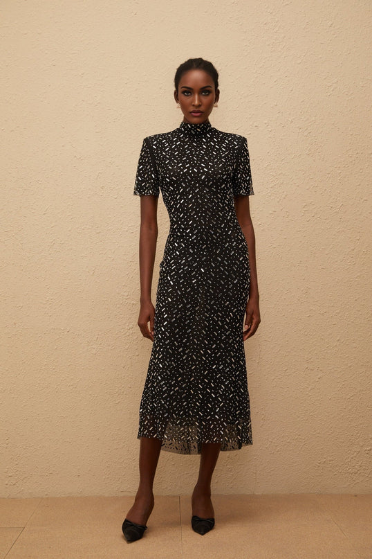 Danielle Mesh Embellished Black Midi Dress with crystal and rhinestone embellishment mock neck short sleeves fitted waistline flared hem calf-length modern glamour luxurious blend of 95% Terylene fiber and 5% Spandex
