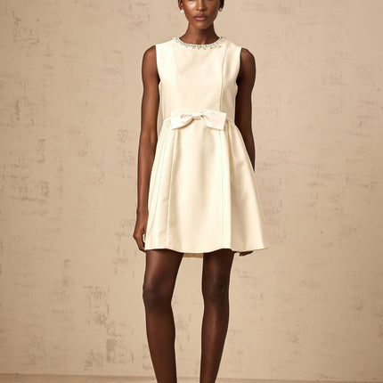 Delizia Mini Dress Ivory White Faux-pearl embellishment Sleeveless Bowknot Pleat Flared skirt Crew neck Rear zip fastening Thigh-length