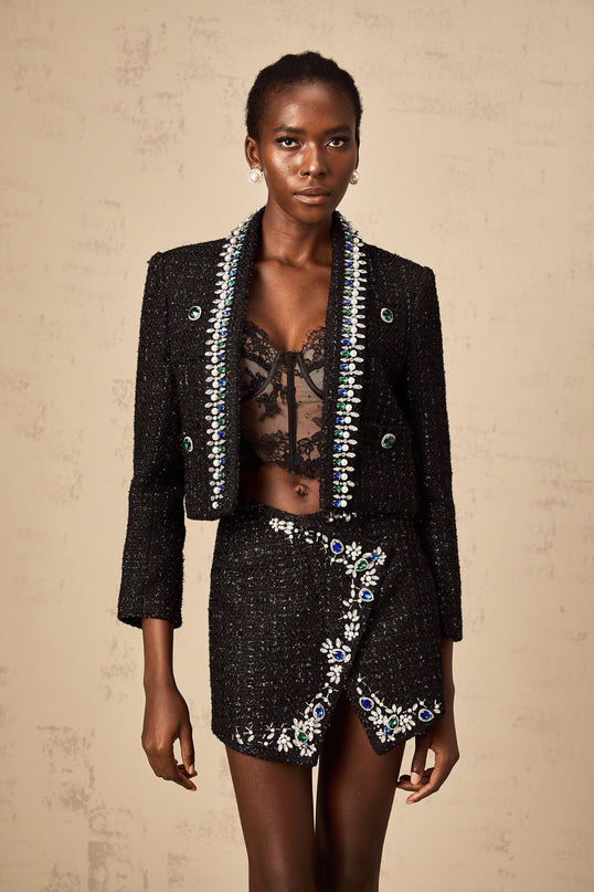 Delphine black crystal tweed jacket and skirt set against a plain background showcasing matching textured fabric with subtle sparkle details