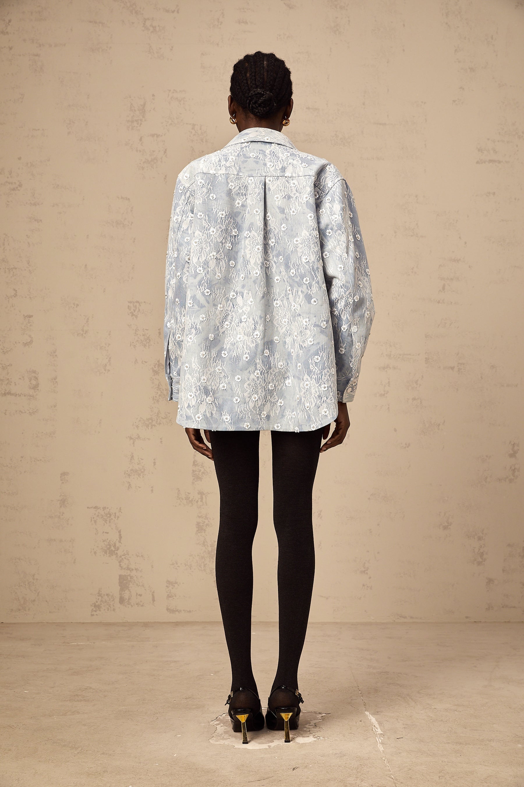 Denim jacket in light blue with blue sequin details and floral applique designs
