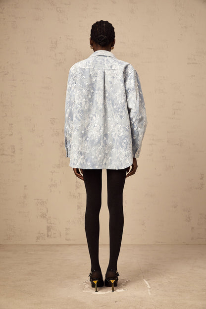 Denim jacket in light blue with blue sequin details and floral applique designs