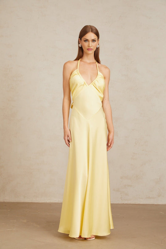 Diana Maxi Dress in Radiant Yellow Halterneck Sleeveless Open Back Self-Tie Cinched Waist Ruched Detailing Flared Hem 100% Terylene Fiber Statement of Refined Elegance Special Occasions Chic Daytime Event Luxurious Ensemble