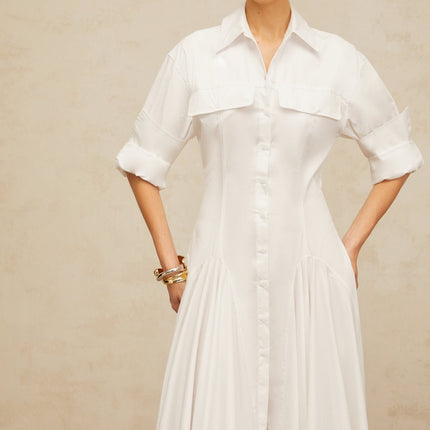 Dulcie White Front-Slit Shirred Shirt Dress 100% Cotton Spread Collar Long Sleeves Fitted Waistline Shirred Effect Front Slit Front Button Fastening Chest Flap Pockets Luxury Sophistication