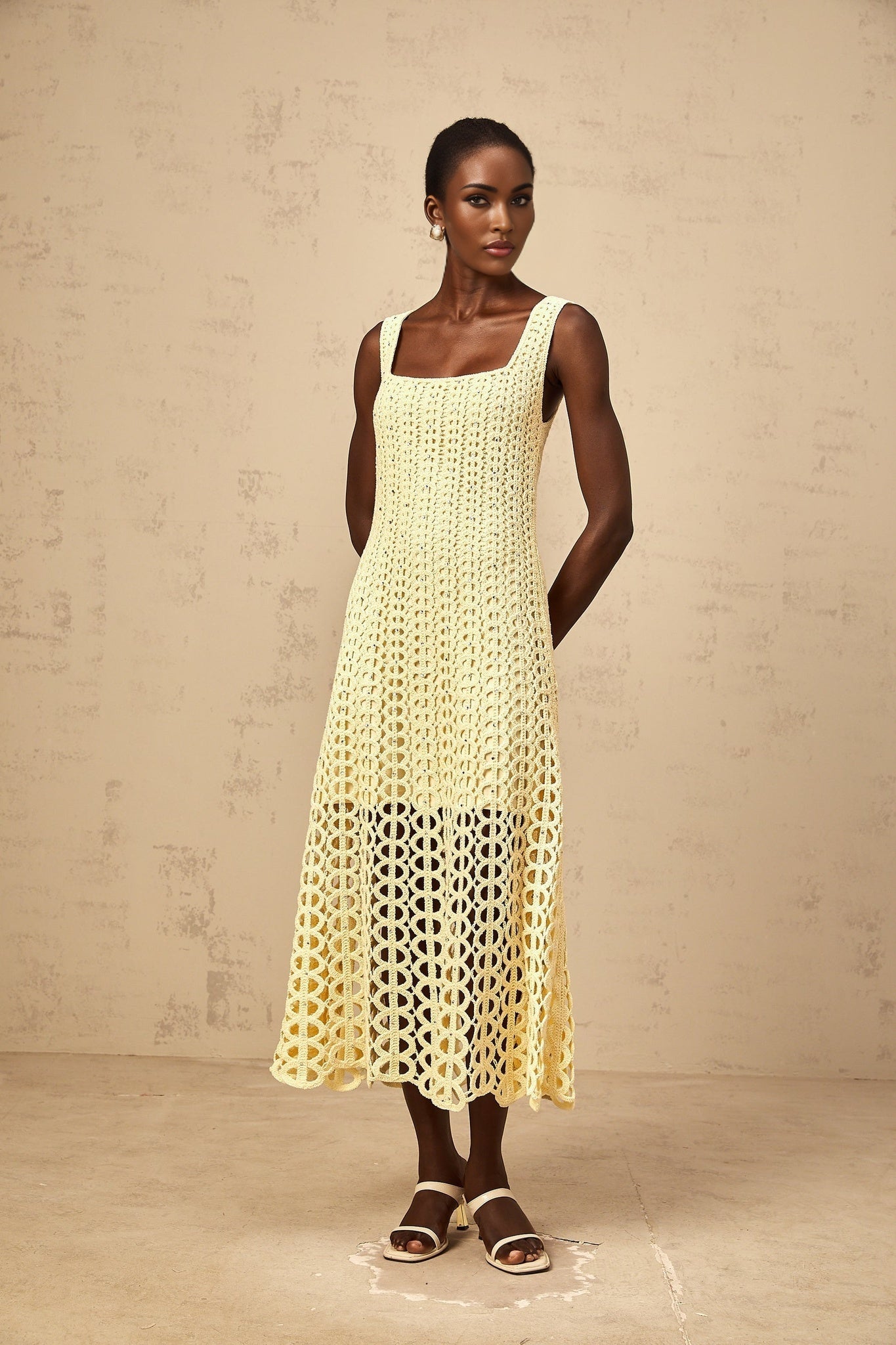 Edelie light yellow midi dress with embellishments and cut out details featuring crochet knit pattern