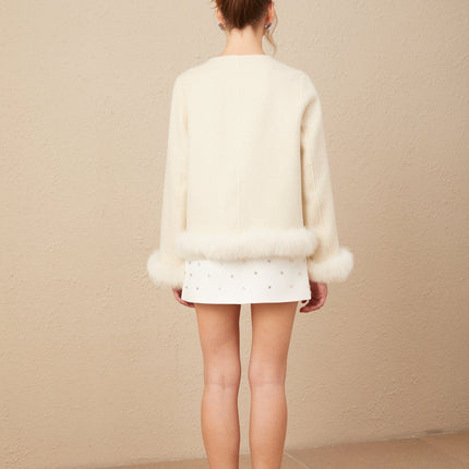 Eden Collarless Two-tone Coat With Detachable Bow in Neutrals faux fur trim front flap pockets curved hem