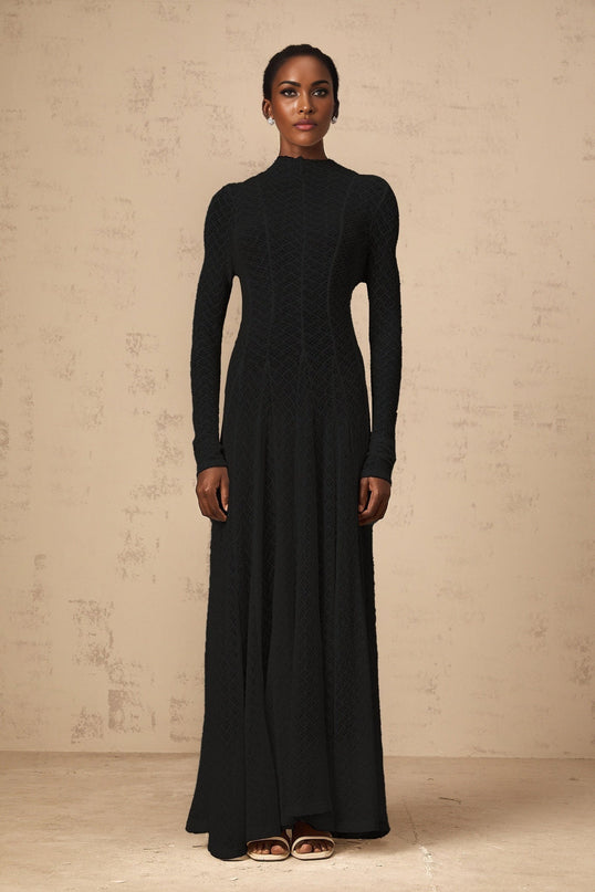 Elegant black lace maxi dress with wavy pattern design full length view on mannequin