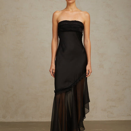Elegant black maxi dress featuring satin fabric with sheer tulle panels long sleeves and a flowing skirt