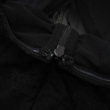 Elegant black maxi dress with crystal embellishments and crossover design featuring long sleeves and a flowing skirt