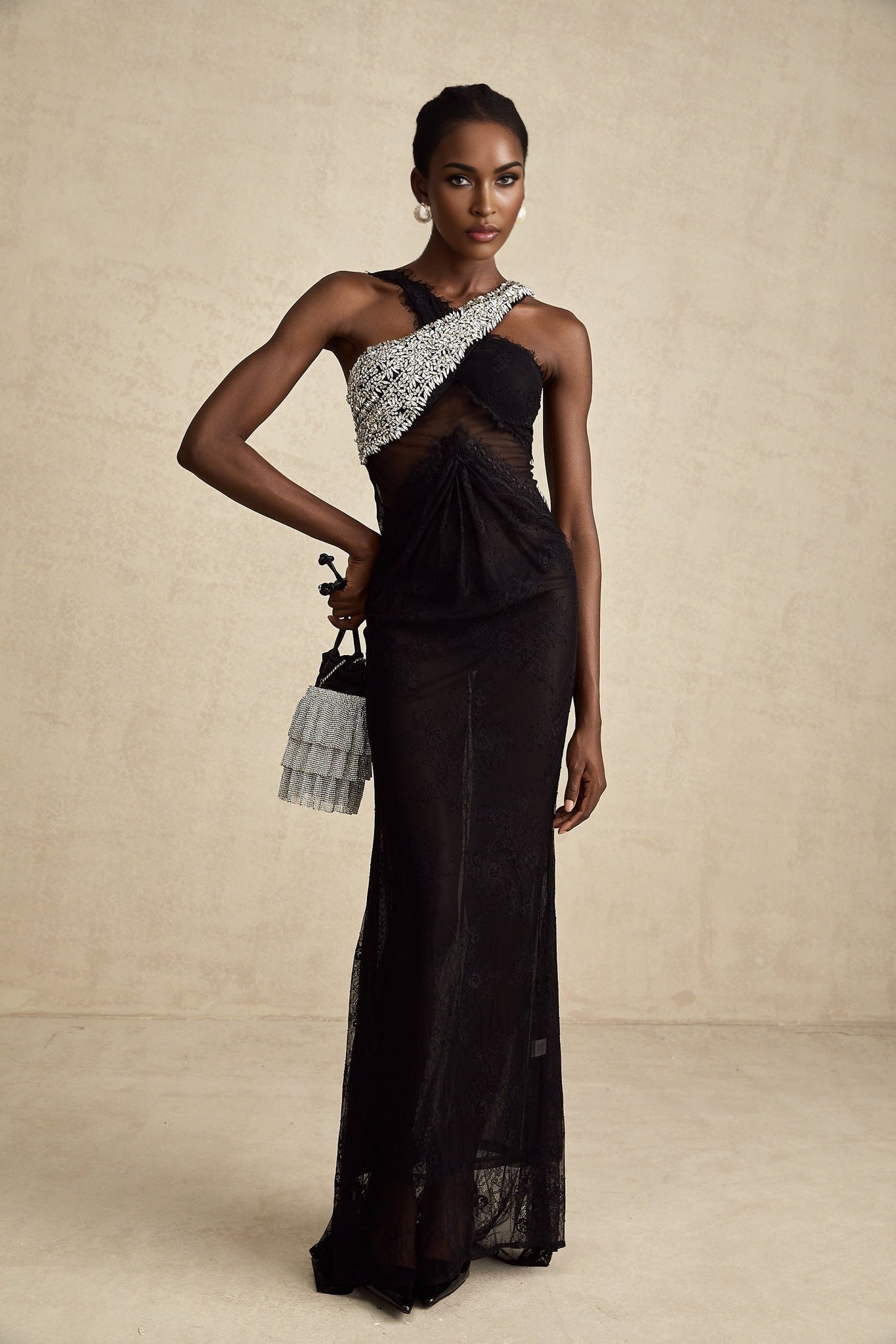 Elegant black maxi dress with crystal embellishments and crossover design