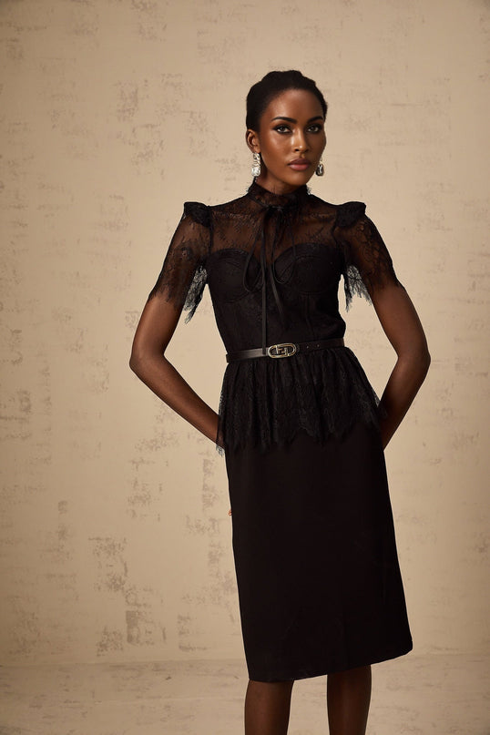 Elegant black midi dress with guipure lace panels and sleeves featuring a fitted silhouette without belt
