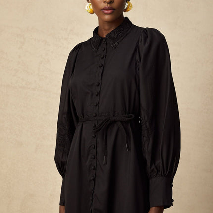 Elegant black midi dress with lace embroidery details and delicate floral patterns throughout