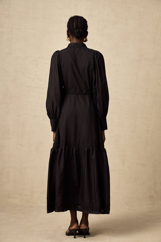 Elegant black midi dress with lace embroidery details and delicate floral patterns