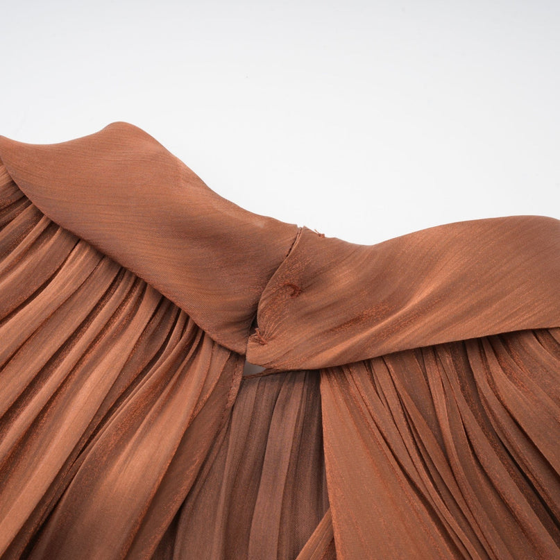 Elegant brown pleated satin maxi dress with flowing skirt and fitted bodice